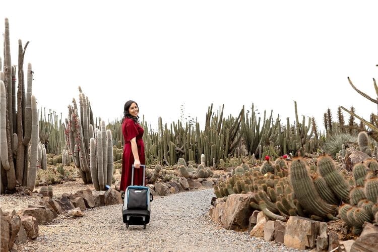 Celebrant Kristin D'Agruma with her best PA System walking through wedding venue Cactus Country