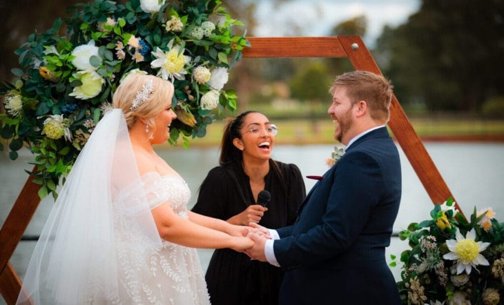 Jess from The Holistic Celebrant marrying a couple and smilling at them