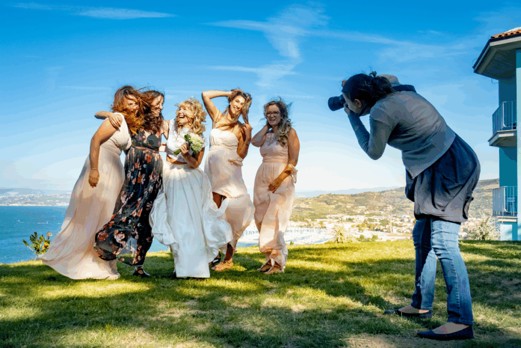 Photographer taking photos of bride and her bridesmaids