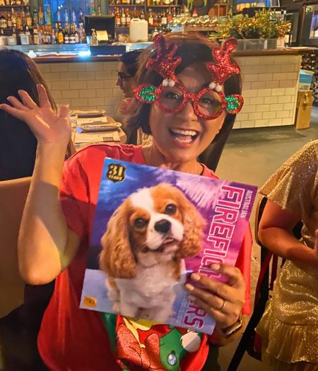 What's better than Lillian Lyon wearing red glitter reindeer glasses? The look on Lillian's face in those same glasses while unwrapping a calendar filled with cute puppies!