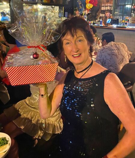In a saucy sequinned little black dress and Santa hat (not pictured), Mary Vevers fought off some tough competition to win 'naughtiest outfit' of the party.